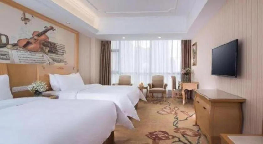Bed in Vienna Hotel Guangxi Yulin Rong County Guinan Road