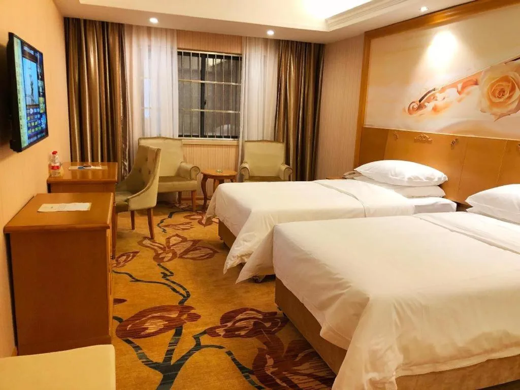 Bed in Vienna Hotel Guangxi Yulin Rong County Guinan Road