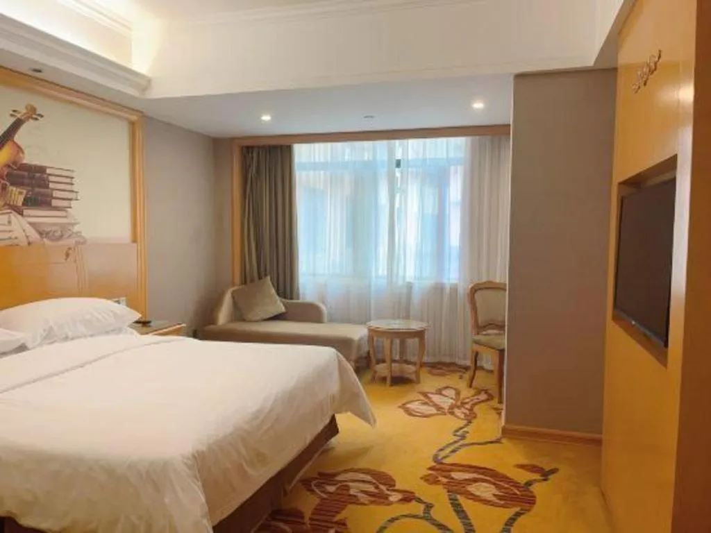 Bed in Vienna Hotel Guangxi Fangcheng
