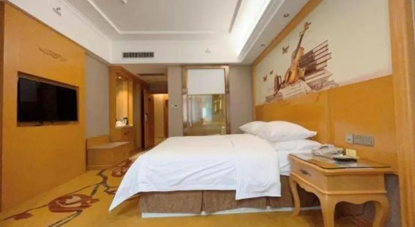 Bed in Vienna Hotel Guangxi Fangcheng