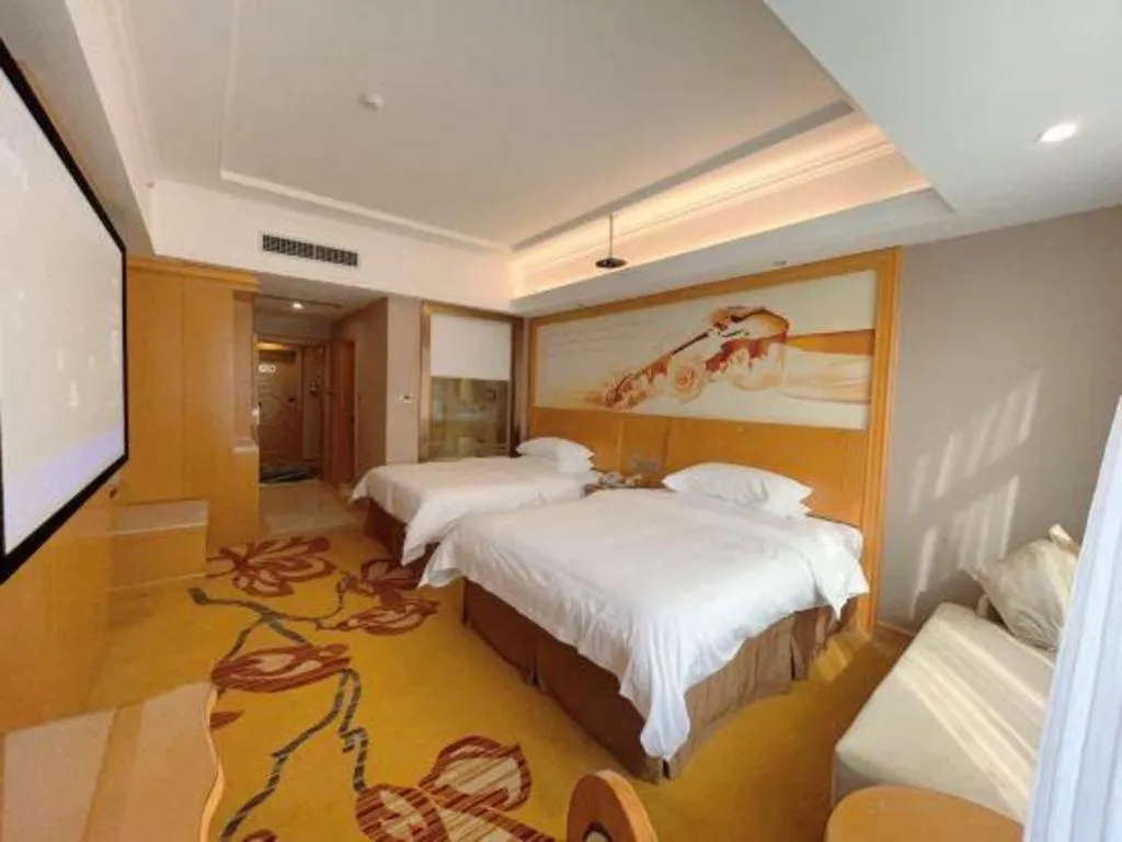 Bed in Vienna Hotel Guangxi Fangcheng