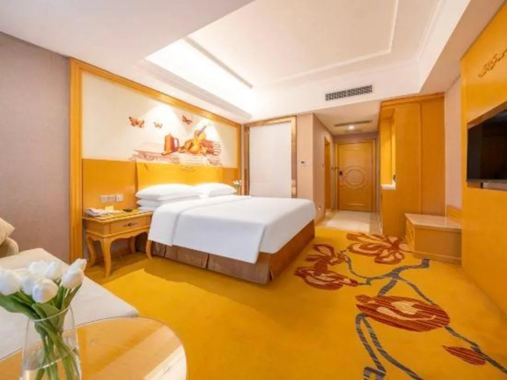 Bed in Vienna Hotel Guangxi Fangcheng