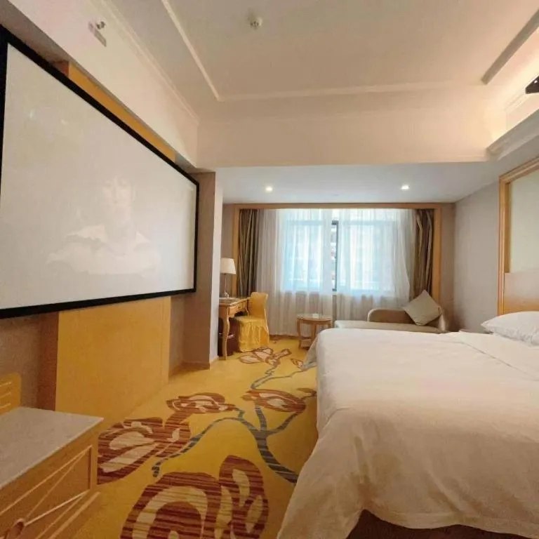 Bed in Vienna Hotel Guangxi Fangcheng