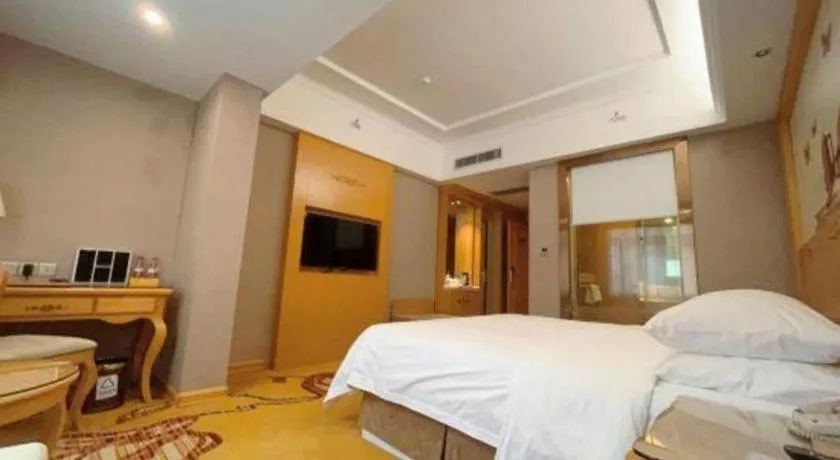 Bed in Vienna Hotel Guangxi Fangcheng