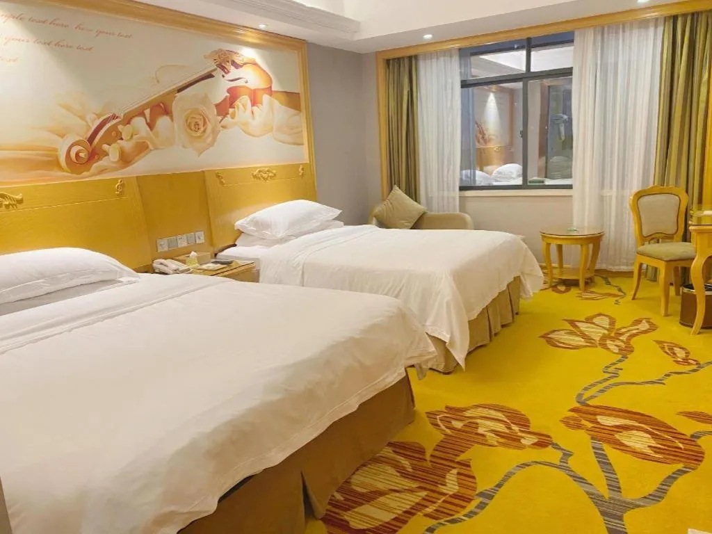 Bed in Vienna Hotel Guangxi Fangcheng