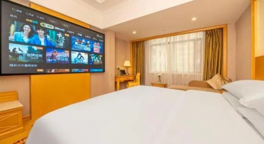 Bed in Vienna Hotel Guangxi Fangcheng