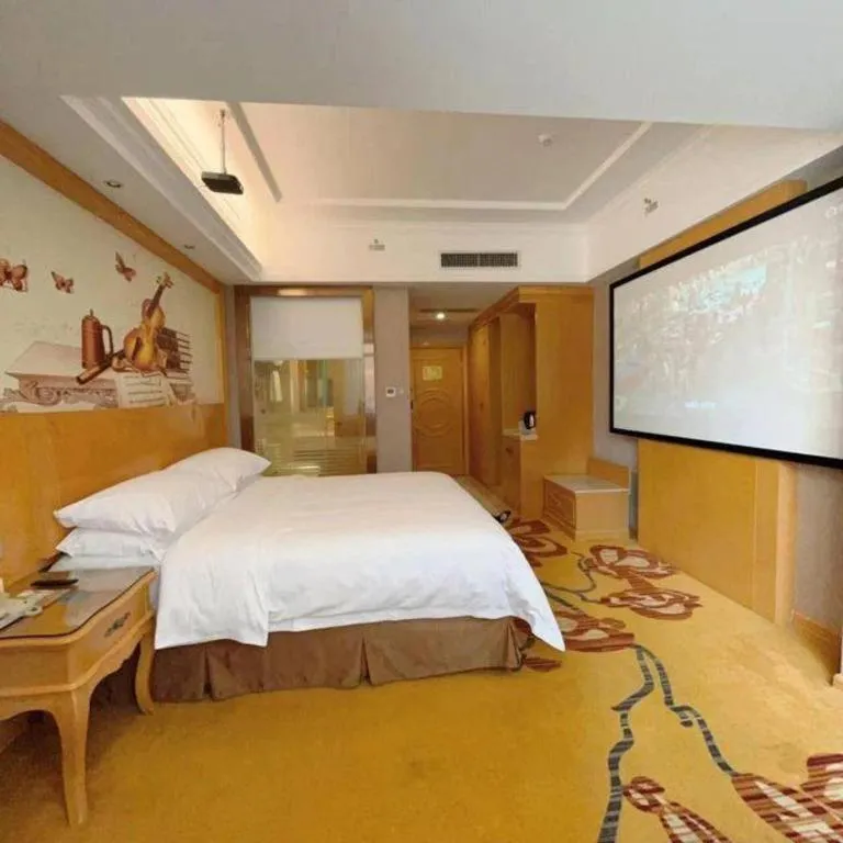 Bed in Vienna Hotel Guangxi Fangcheng