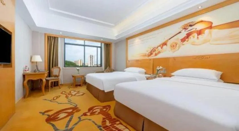 Bed in Vienna Hotel Guangxi Fangcheng