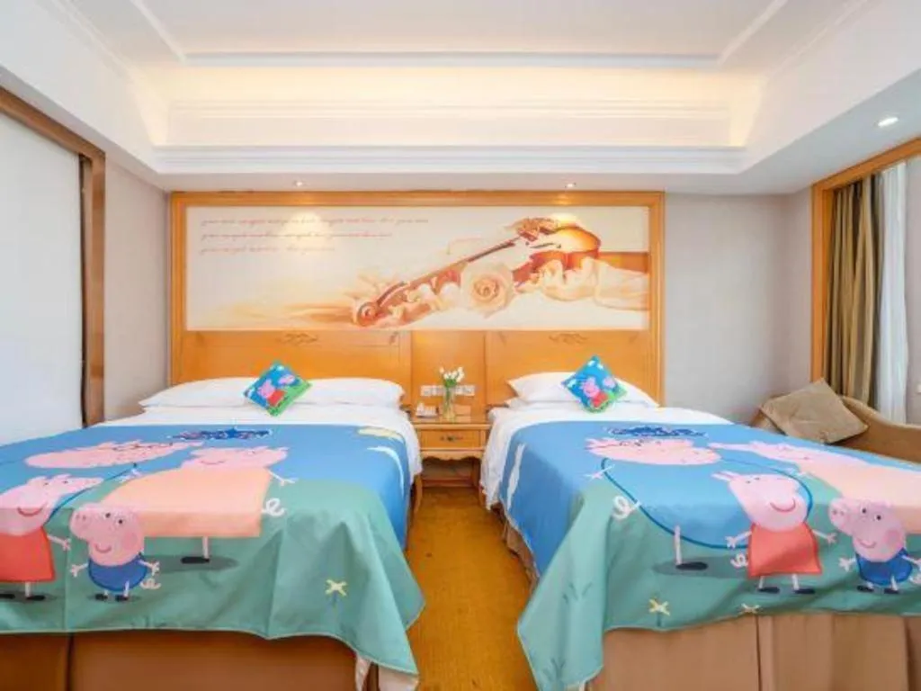 Bed in Vienna Hotel Guangxi Fangcheng