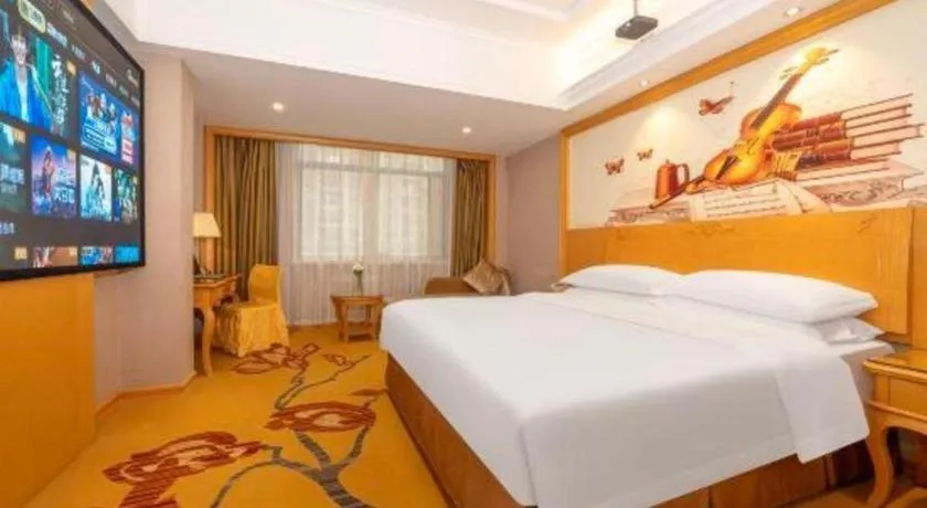 Bed in Vienna Hotel Guangxi Fangcheng