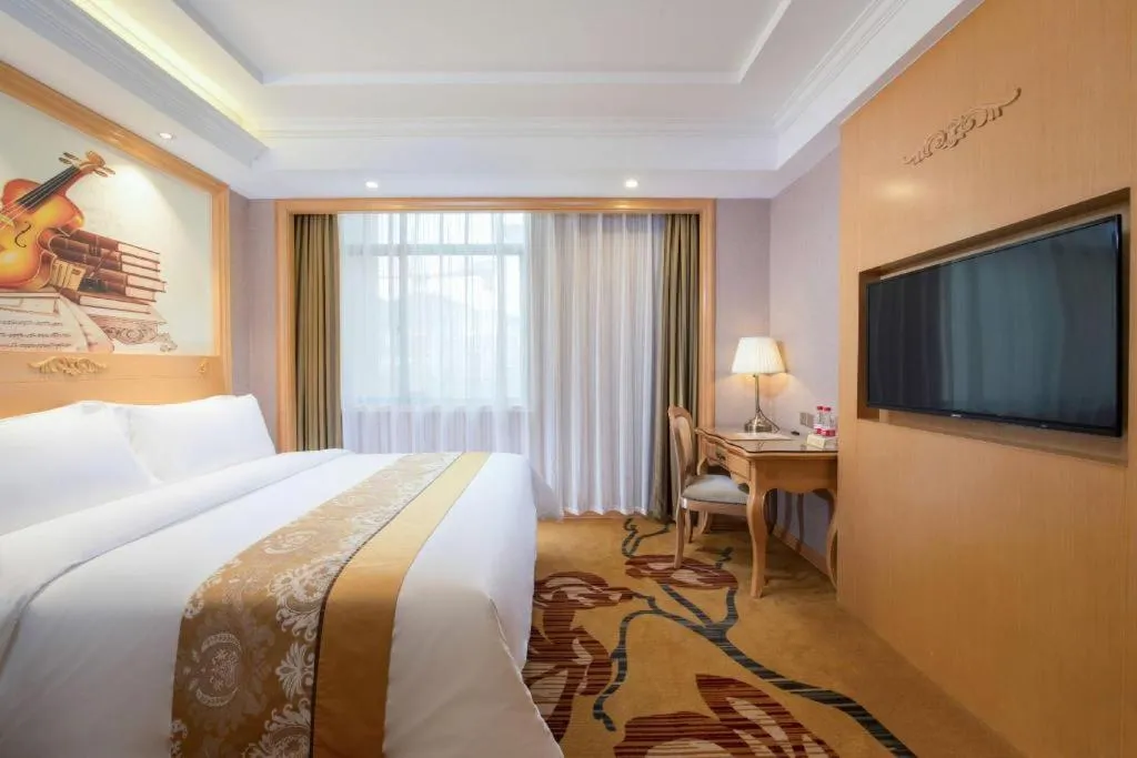 Bed in Vienna Hotel Guangxi Fangcheng