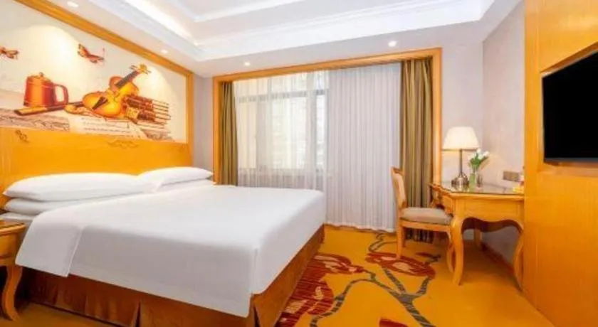 Bed in Vienna Hotel Guangxi Fangcheng