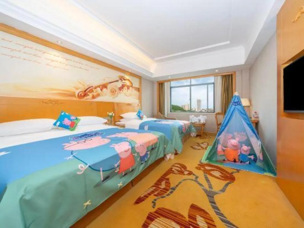 Bed in Vienna Hotel Guangxi Fangcheng