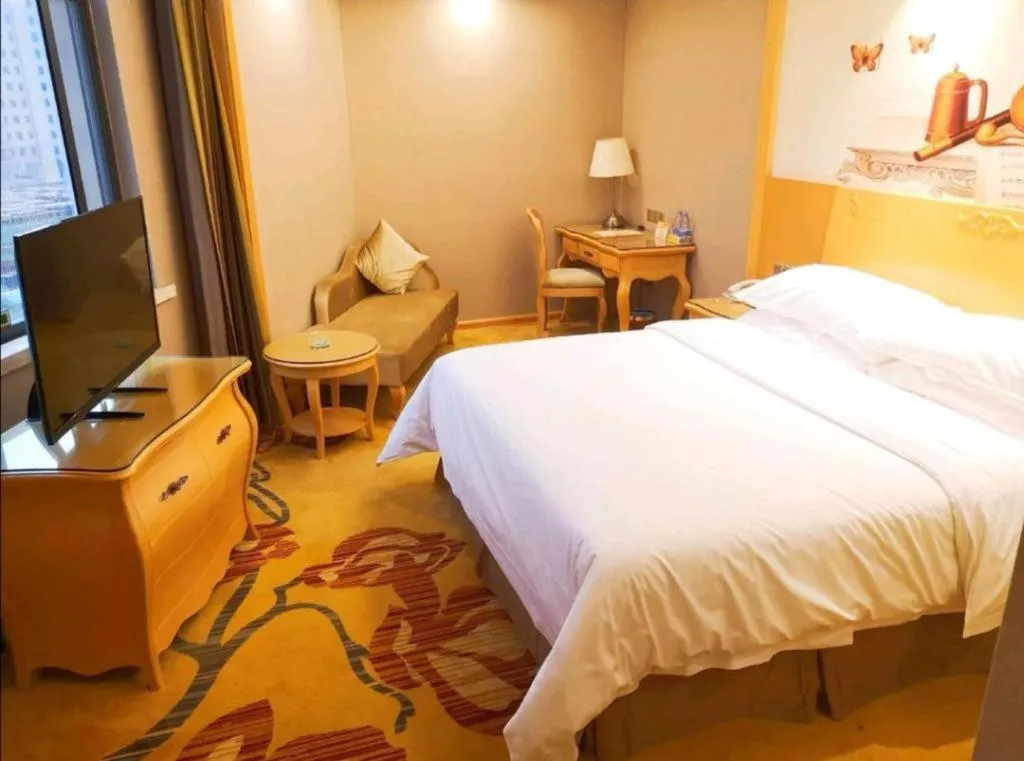 Bed in Vienna Hotel Guangxi Fangcheng