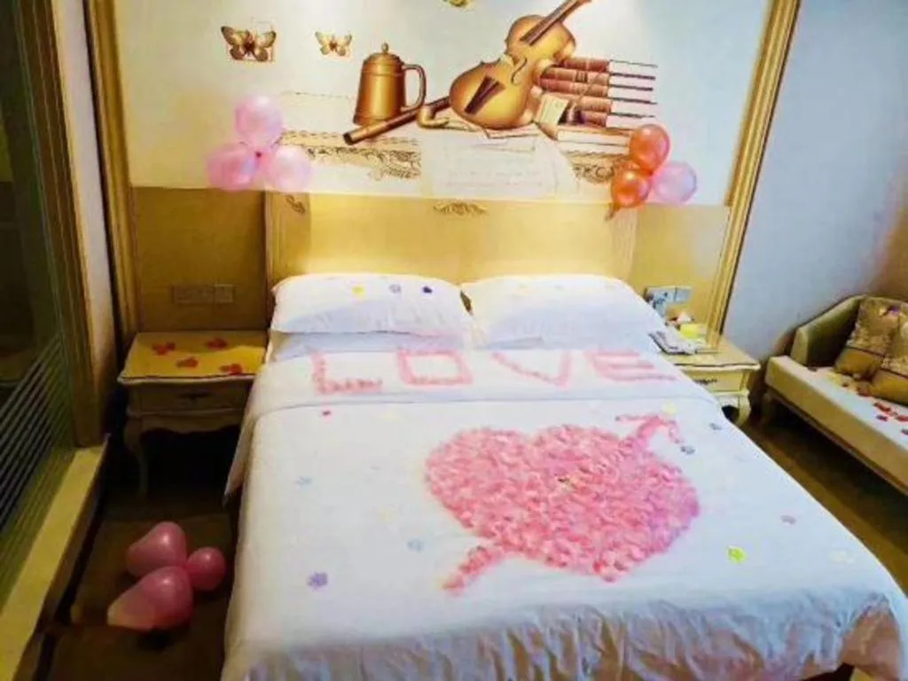 Bed in Vienna Hotel Guangxi Fangcheng