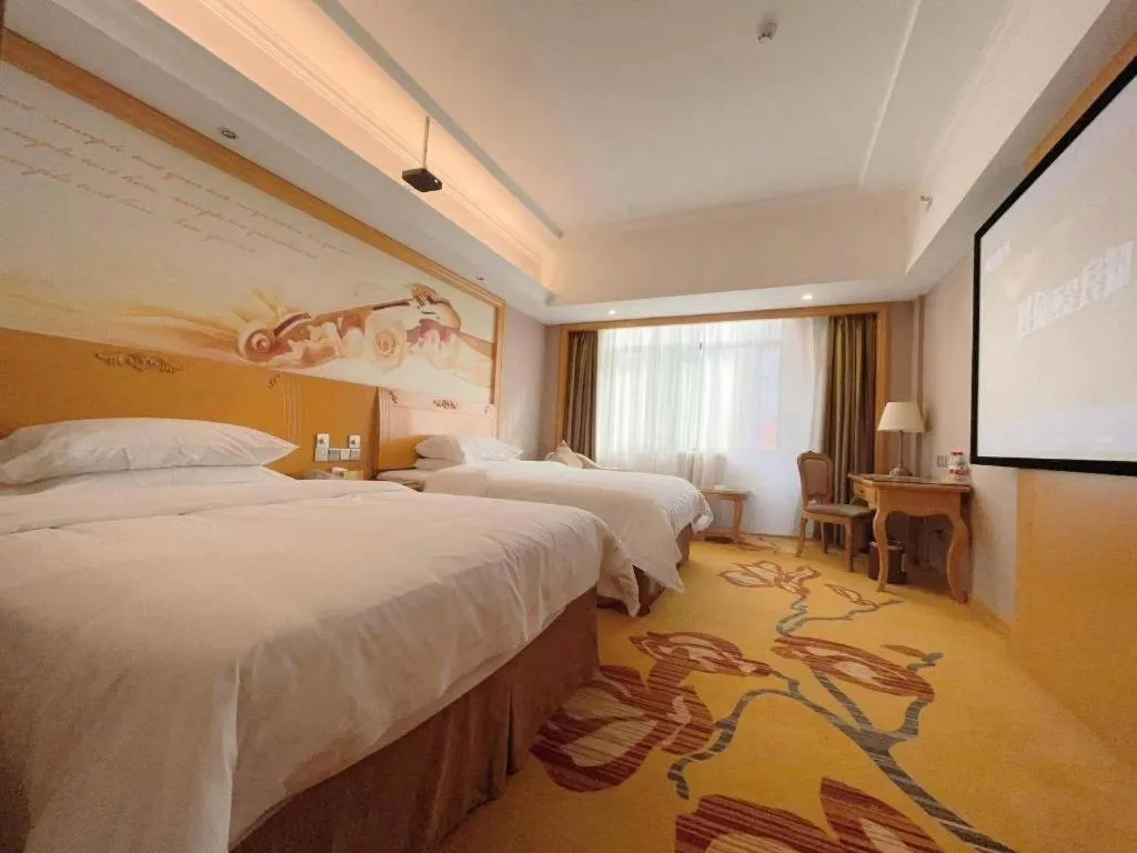 Bed in Vienna Hotel Guangxi Fangcheng