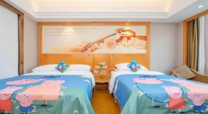 Bed in Vienna Hotel Guangxi Fangcheng