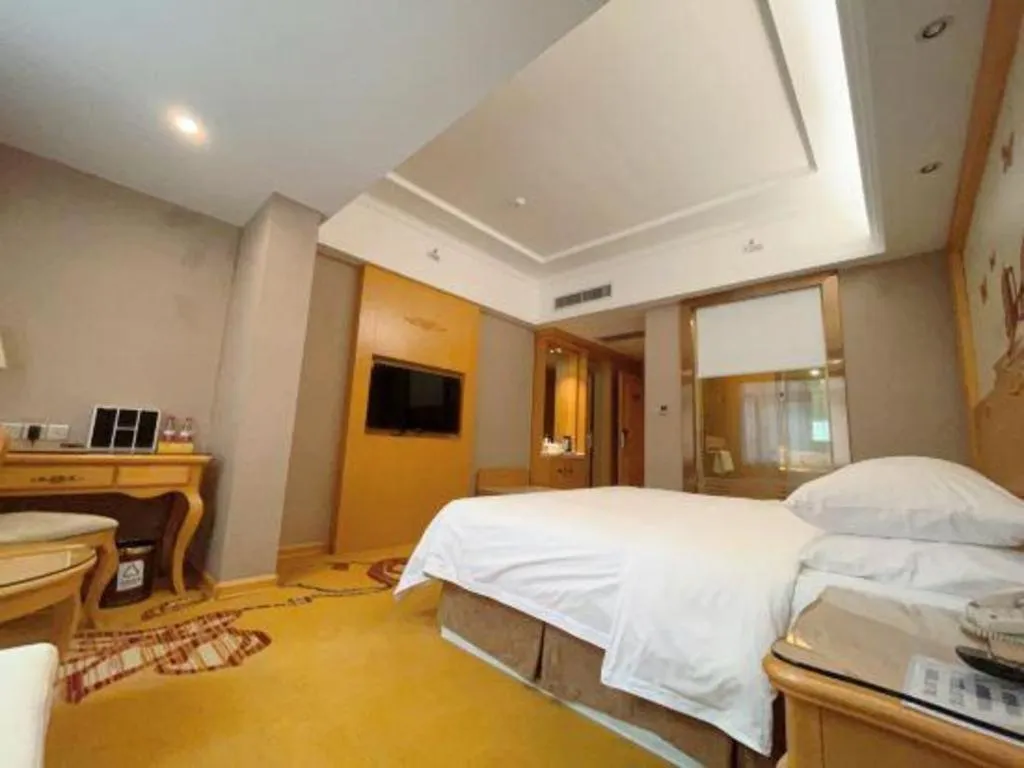 Bed in Vienna Hotel Guangxi Fangcheng