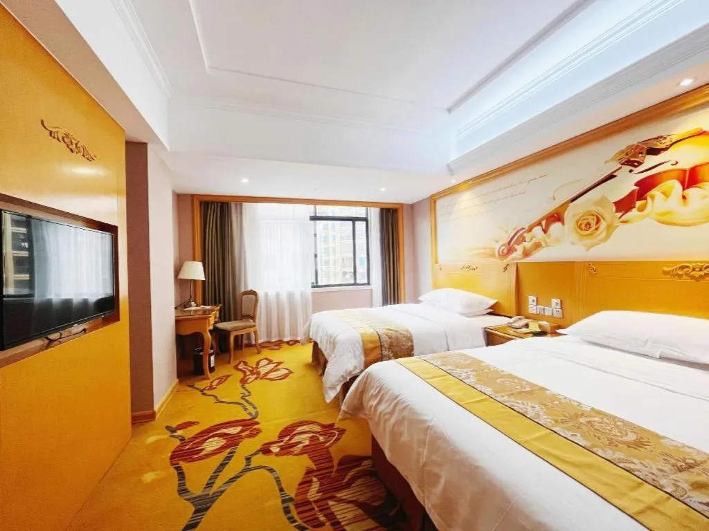 Bed in Vienna Hotel Guangxi Fangcheng