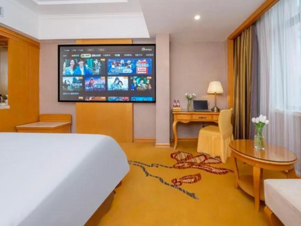 Bed in Vienna Hotel Guangxi Fangcheng