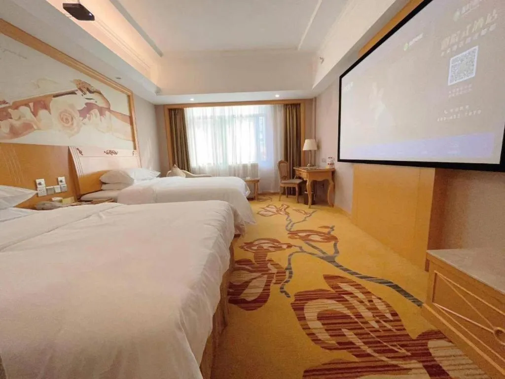 Bed in Vienna Hotel Guangxi Fangcheng