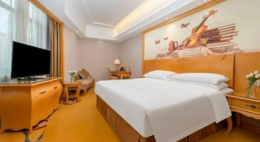 Bed in Vienna Hotel Guangxi Fangcheng