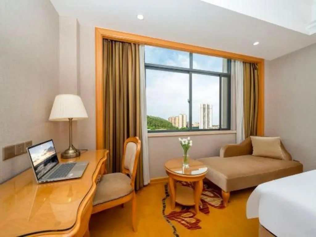 Bed in Vienna Hotel Guangxi Fangcheng