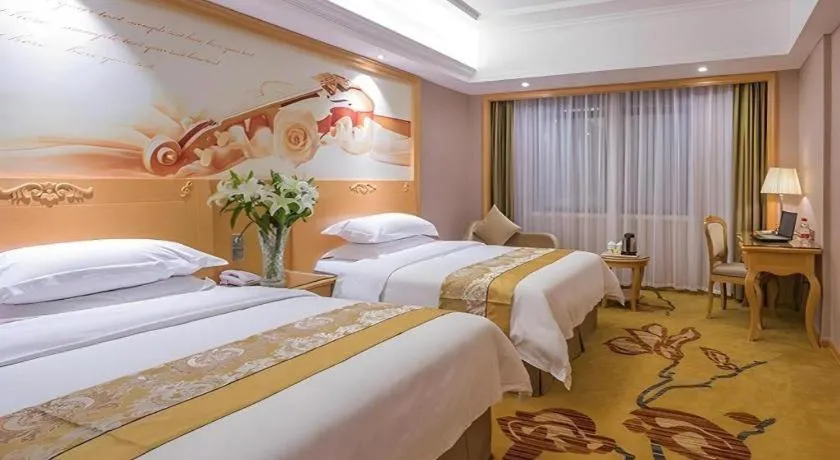 Bed in Vienna Hotel Guangxi Fangcheng