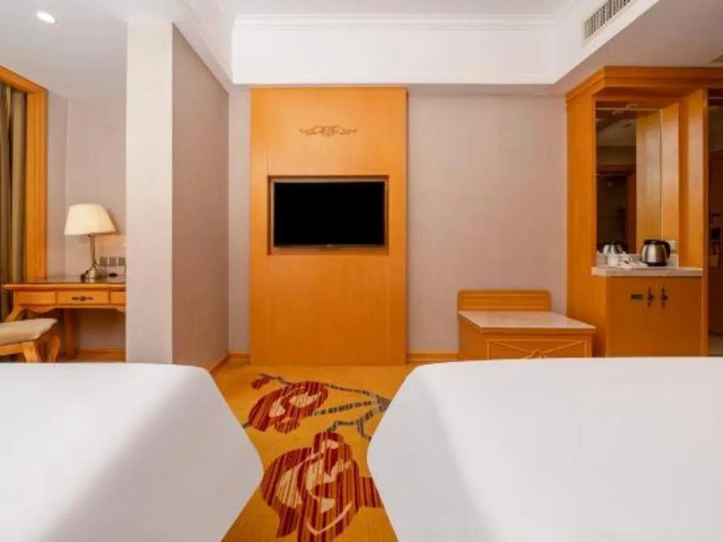 Bed in Vienna Hotel Guangxi Fangcheng