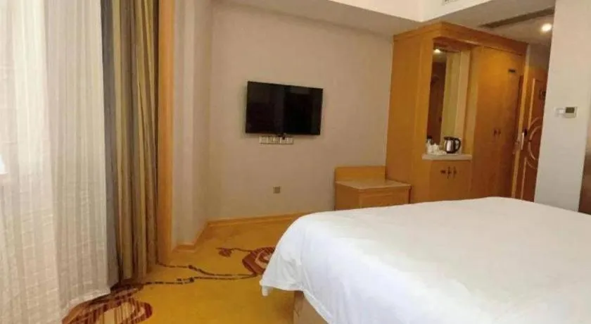 Bed in Vienna Hotel Guangxi Fangcheng