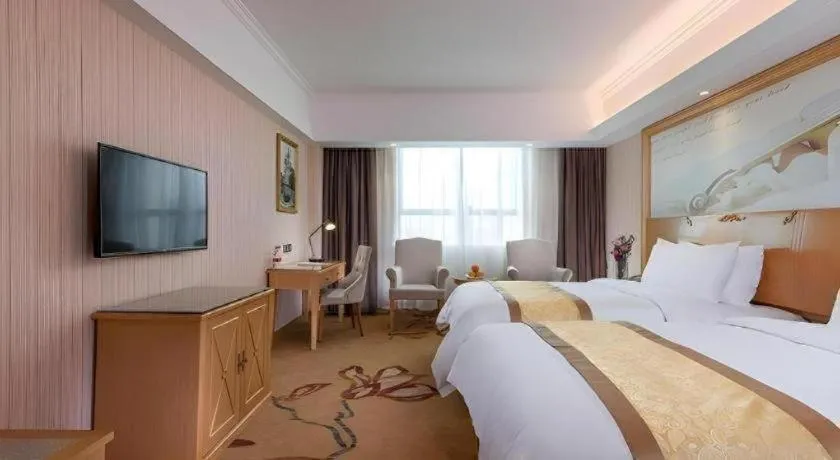 Bed in Vienna Hotel Shenzhen Pingdi Huancheng South Road