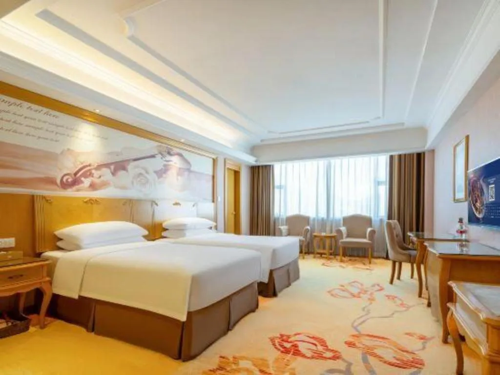 Bed in Vienna Hotel Shenzhen Pingdi Huancheng South Road