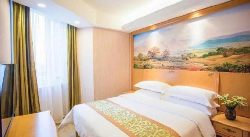 Bed in Vienna Hotel Shandong Laizhou Langhu International Plaza