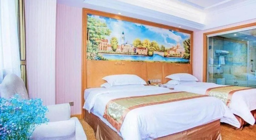 Bed in Vienna Hotel Shandong Laizhou Langhu International Plaza
