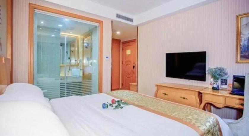 Bed in Vienna Hotel Shandong Laizhou Langhu International Plaza