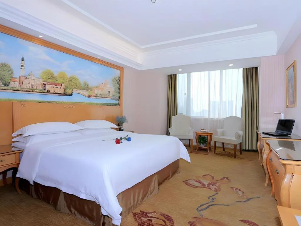 Bed in Vienna Hotel Shandong Laizhou Langhu International Plaza
