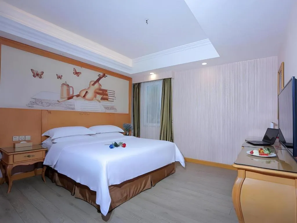 Bed in Vienna Hotel Shandong Laizhou Langhu International Plaza