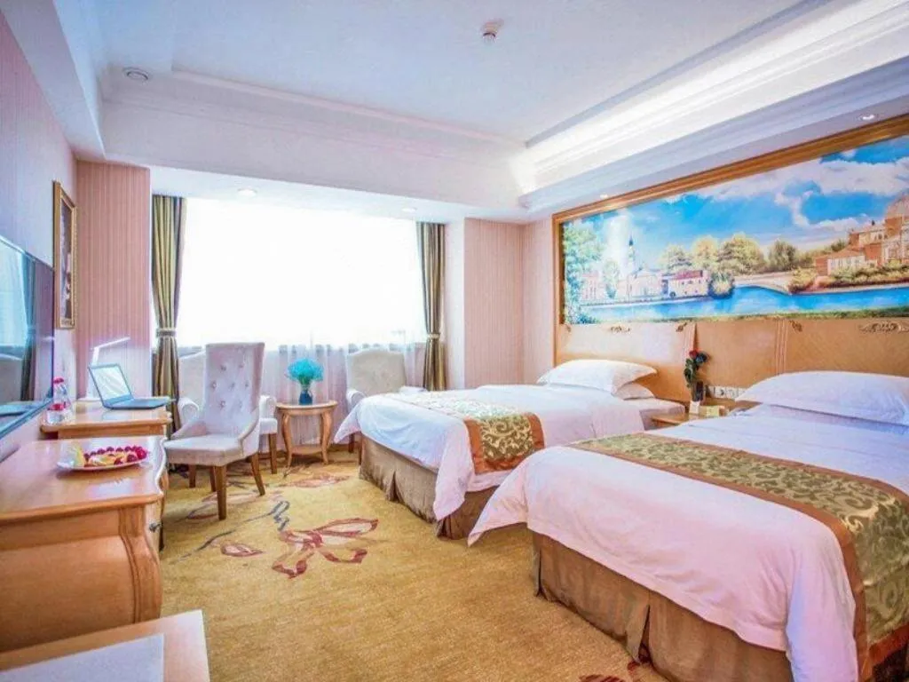 Bed in Vienna Hotel Shandong Laizhou Langhu International Plaza