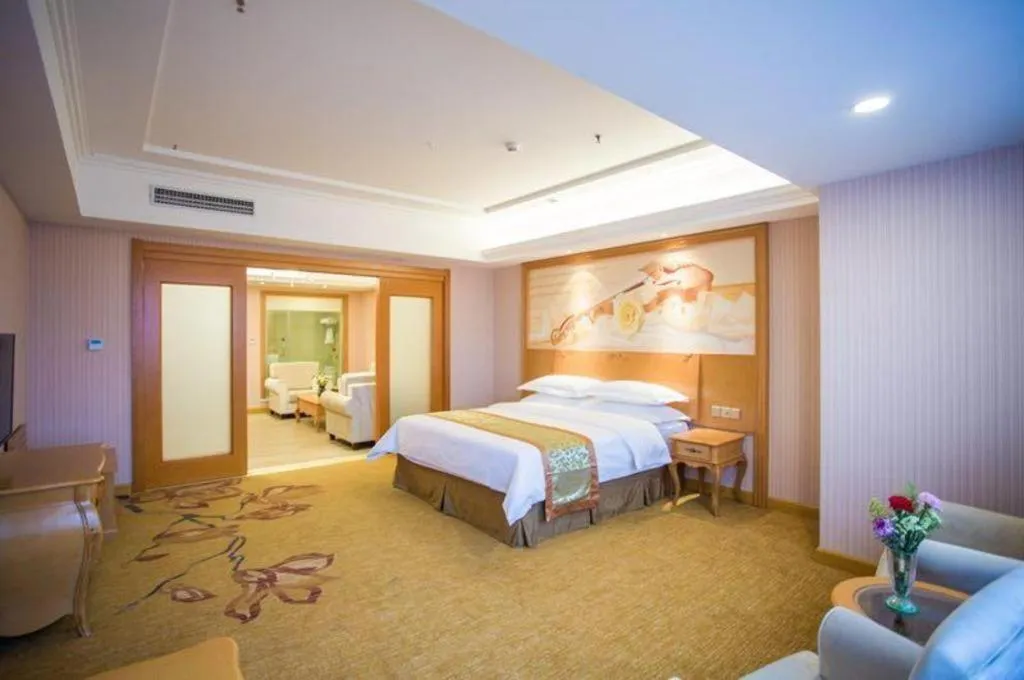 Bed in Vienna Hotel Shandong Laizhou Langhu International Plaza
