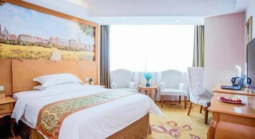 Bed in Vienna Hotel Shandong Laizhou Langhu International Plaza
