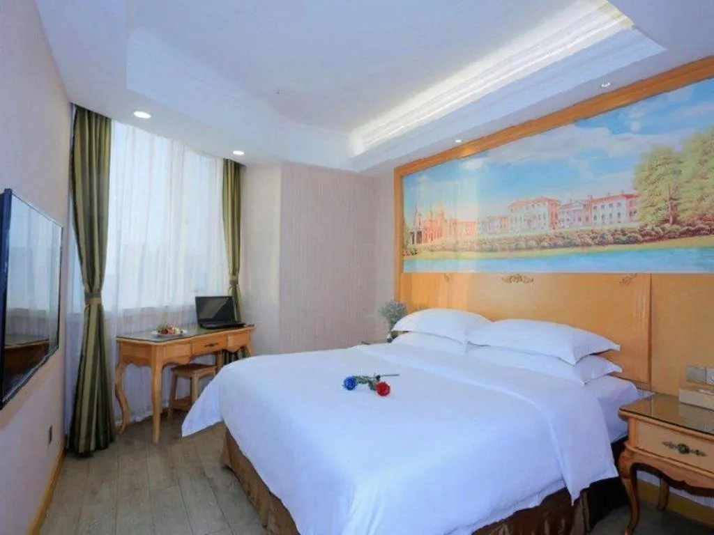 Bed in Vienna Hotel Shandong Laizhou Langhu International Plaza
