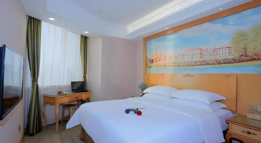 Bed in Vienna Hotel Shandong Laizhou Langhu International Plaza