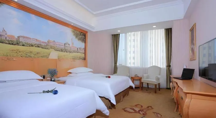 Bed in Vienna Hotel Shandong Laizhou Langhu International Plaza