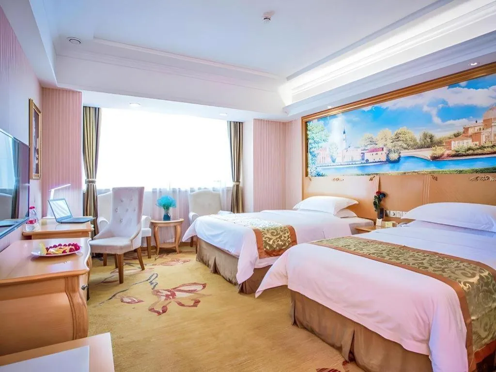 Bed in Vienna Hotel Shandong Laizhou Langhu International Plaza