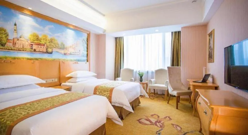Bed in Vienna Hotel Shandong Laizhou Langhu International Plaza