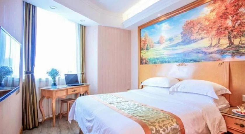 Bed in Vienna Hotel Shandong Laizhou Langhu International Plaza