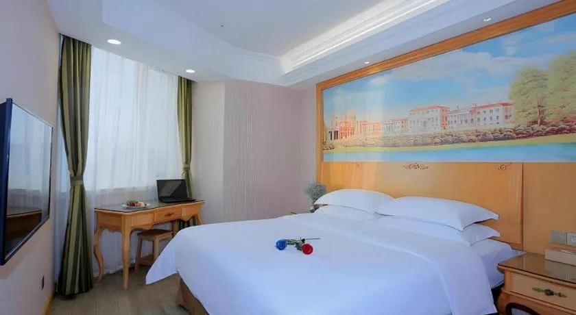 Bed in Vienna Hotel Shandong Laizhou Langhu International Plaza