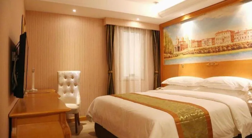Bed in Vienna Hotel Shandong Laizhou Langhu International Plaza