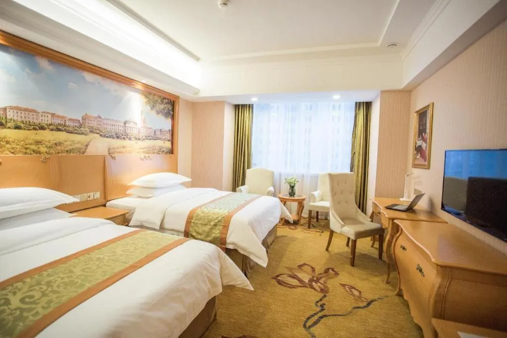 Bed in Vienna Hotel Shandong Laizhou Langhu International Plaza