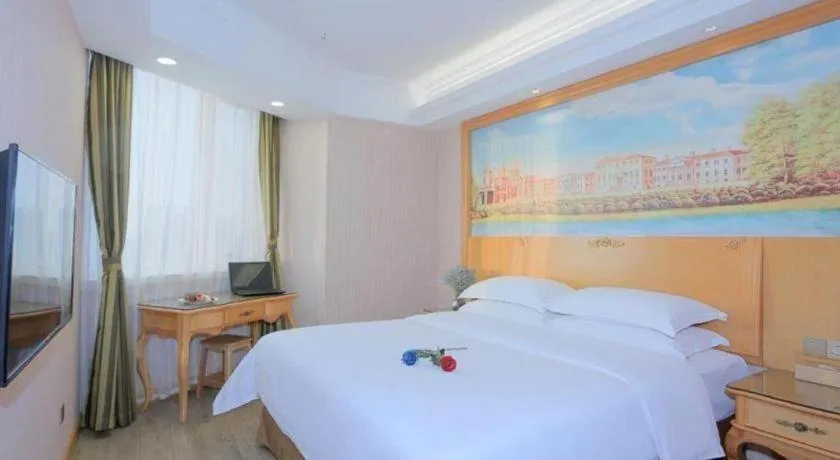 Bed in Vienna Hotel Shandong Laizhou Langhu International Plaza